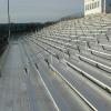 After renovation (all new aluminum plank, added risers, added aisle rails) picture of a 20 row high, 150' long bleacher seating 1,800 at Winnacunnet HS in Hampton, NH