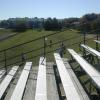 Before renovation (3 pipe guard rail system, all wood plank) picture of a 20 row high, 150' long bleacher seating 1,800 at Winnacunnet HS in Hampton, NH