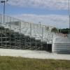 Clem Lemire Stadium, Manchester Memorial HS, Manchester, NH - visitor side 10 row high, 100' long elevated angle frame bleacher seating 500 


